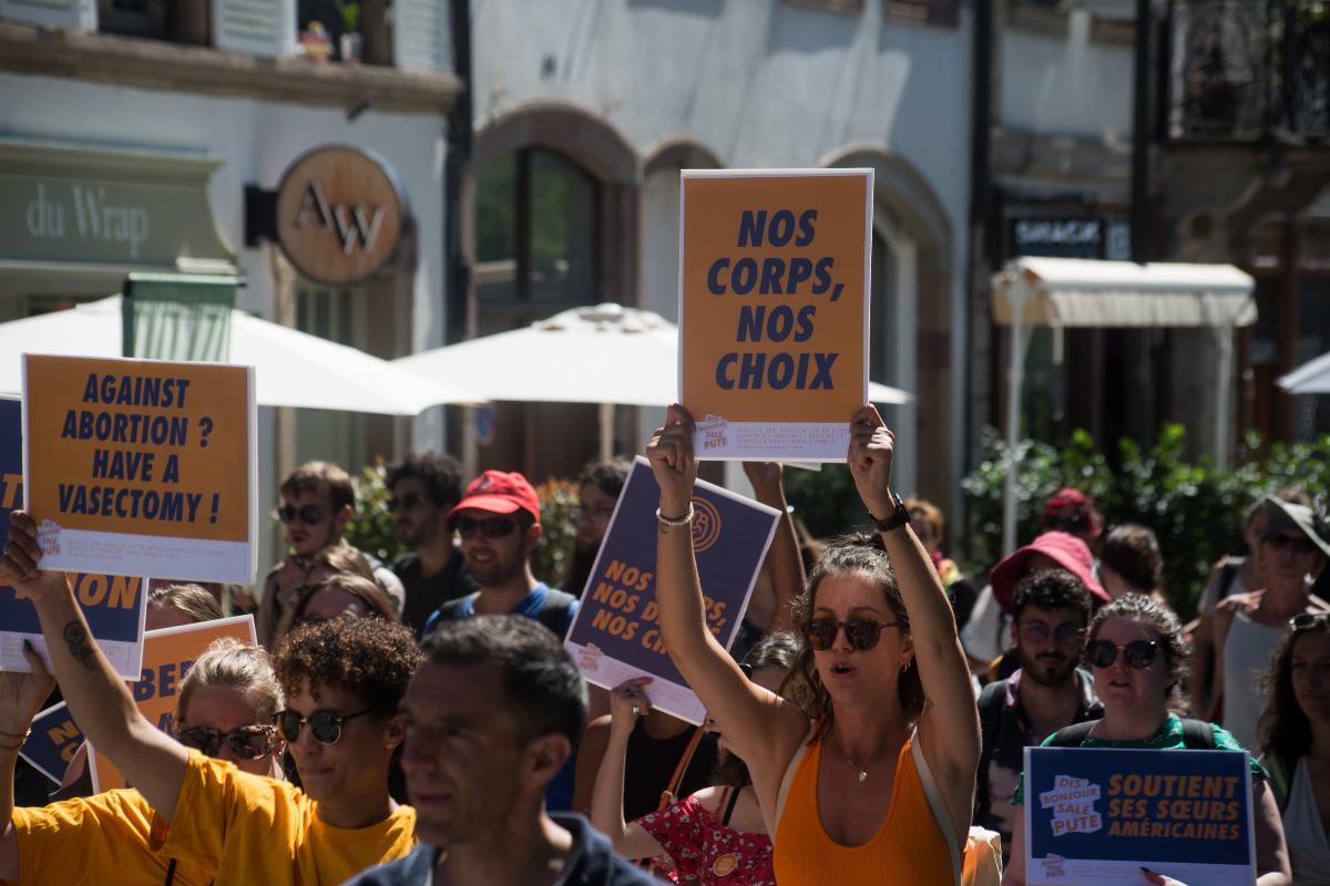 Strasbourg - France - 2 July 2022 - Women protesting for the free abortion with placards in french : nos corps nos choix, in english: our body, our choice